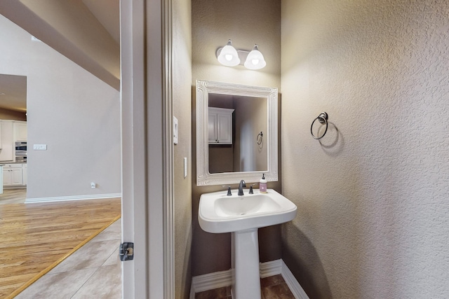 bathroom featuring wood-type flooring