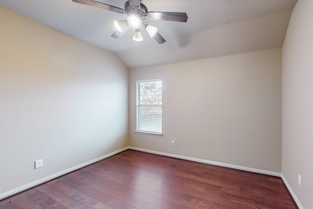 unfurnished room with vaulted ceiling, dark hardwood / wood-style floors, and ceiling fan