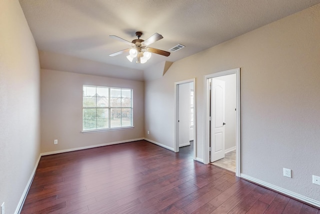 unfurnished room featuring ceiling fan and dark hardwood / wood-style floors