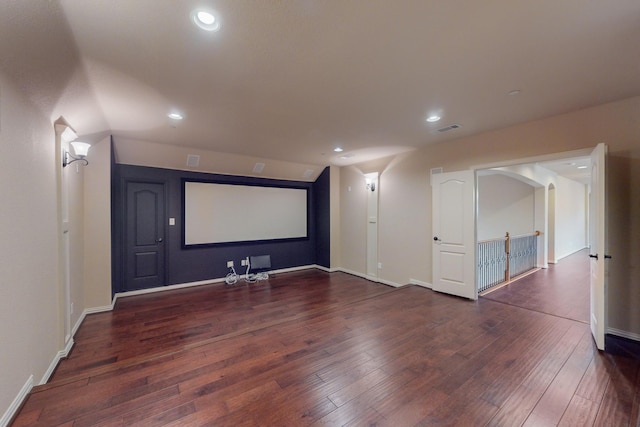 home theater room with dark wood-type flooring