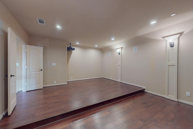 empty room featuring dark hardwood / wood-style flooring