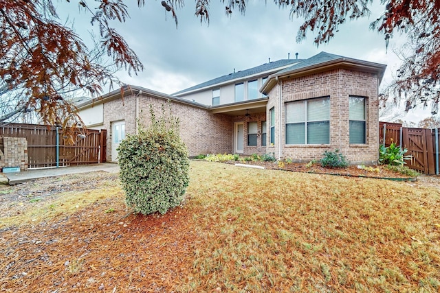 rear view of property with a lawn