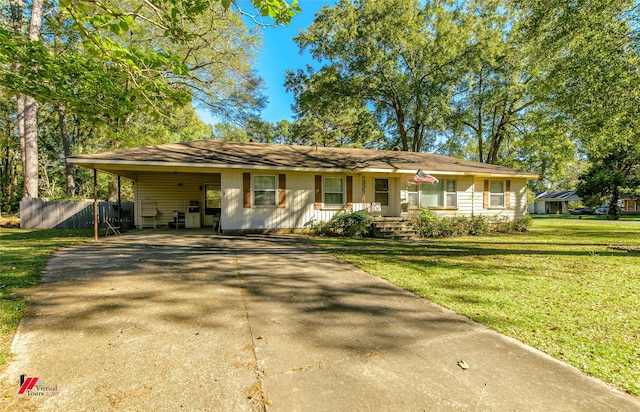 single story home featuring a front yard and a carport