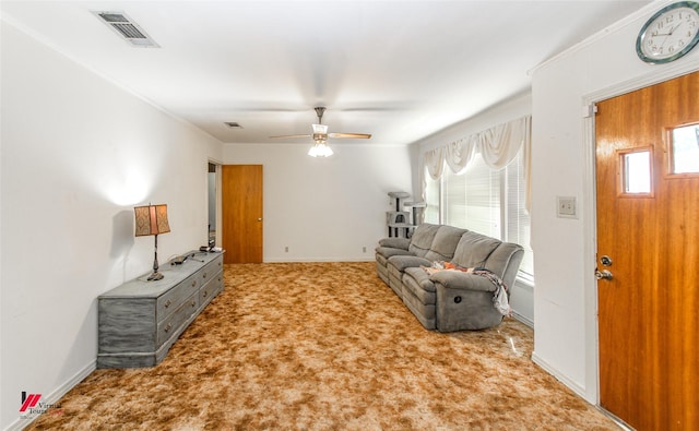 carpeted living room with ceiling fan