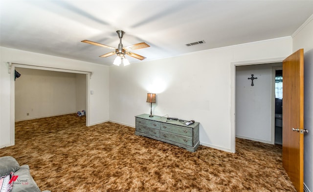 interior space with crown molding and ceiling fan