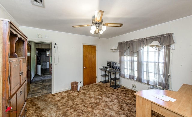 carpeted office featuring crown molding and ceiling fan