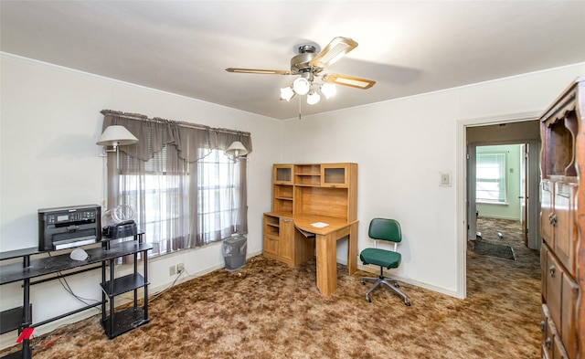 carpeted office with ornamental molding and ceiling fan