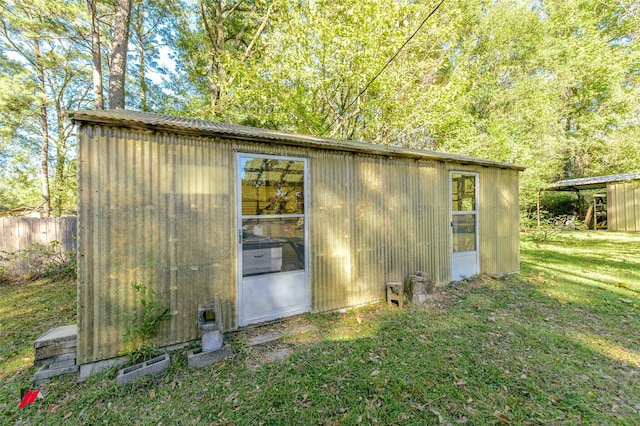 view of outdoor structure with a lawn