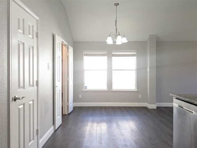 unfurnished dining area with dark hardwood / wood-style floors, vaulted ceiling, and a notable chandelier