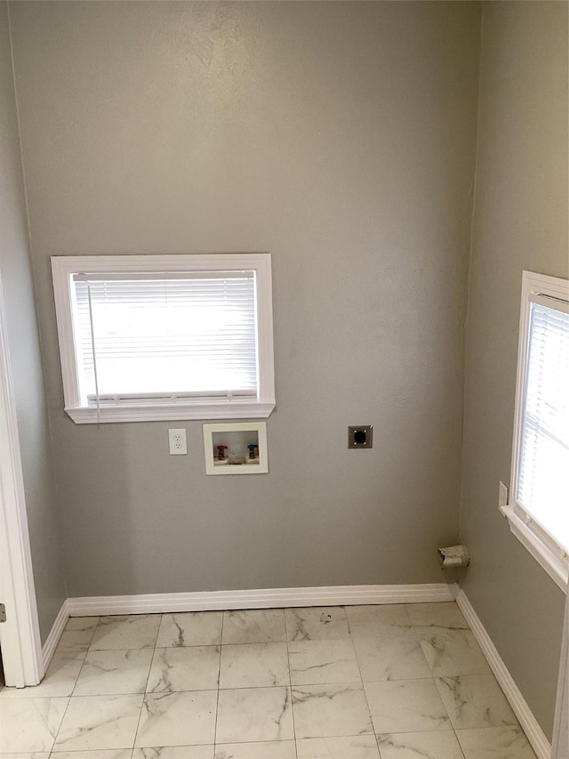 laundry area with hookup for a washing machine and hookup for an electric dryer