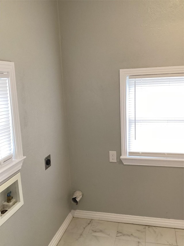 laundry area with hookup for a washing machine, plenty of natural light, and electric dryer hookup