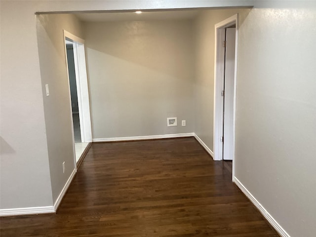 corridor with dark wood-type flooring