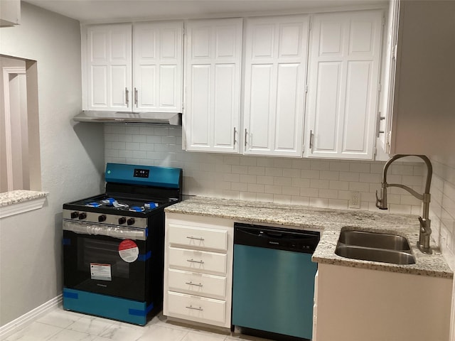 kitchen with stainless steel appliances, white cabinetry, and sink