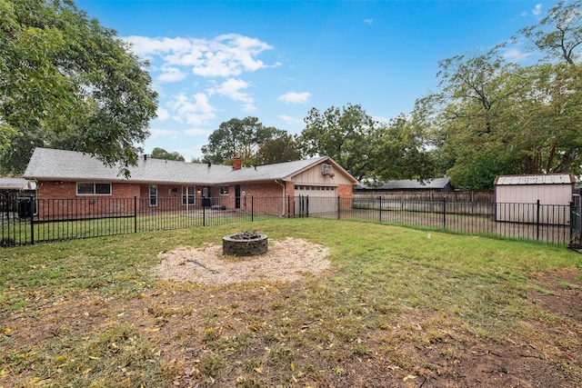 view of yard with an outdoor fire pit