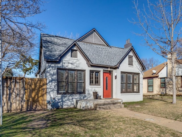 tudor house with a front lawn