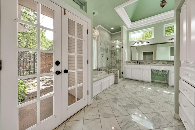 bathroom featuring french doors, ornamental molding, vanity, and plus walk in shower