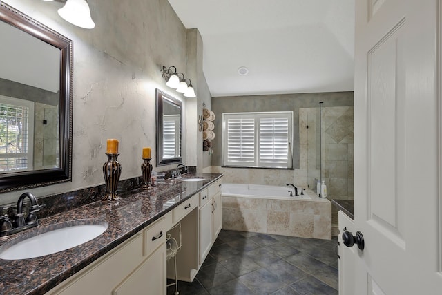 bathroom featuring tile patterned floors, vanity, and independent shower and bath