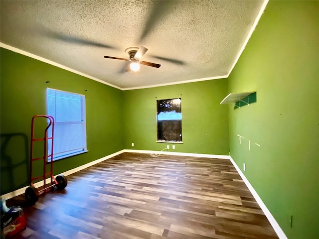 unfurnished bedroom with crown molding, ceiling fan, hardwood / wood-style flooring, and a textured ceiling