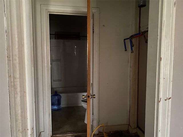 bathroom featuring a bathing tub and toilet