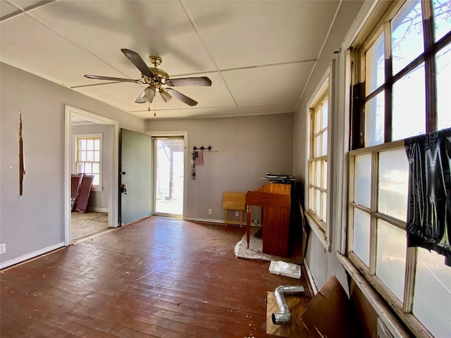 foyer entrance with ceiling fan and dark hardwood / wood-style flooring