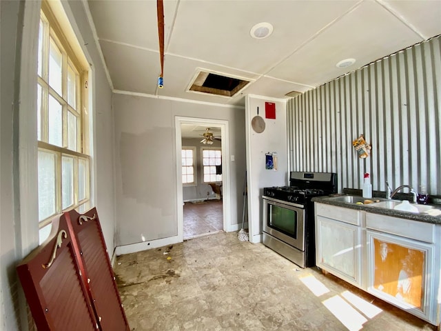 kitchen featuring sink and stainless steel gas range oven