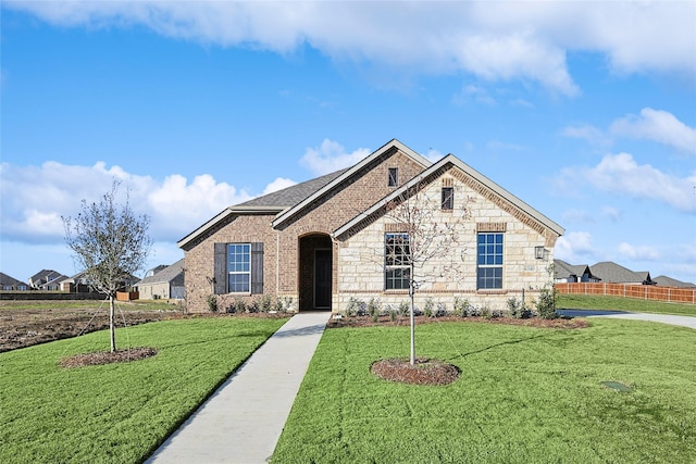 view of front of home featuring a front lawn