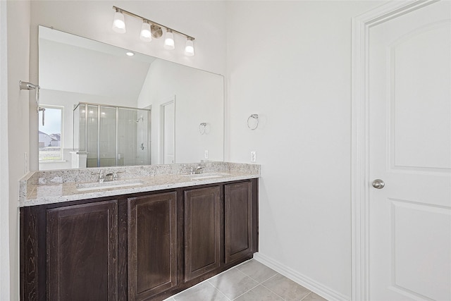 bathroom featuring vanity, an enclosed shower, and tile patterned flooring