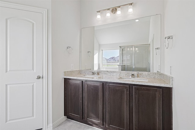 bathroom with vanity, an enclosed shower, and tile patterned flooring