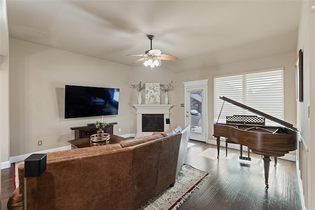 living room with ceiling fan and hardwood / wood-style floors