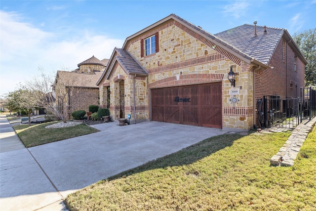 view of front of house with a garage and a front yard