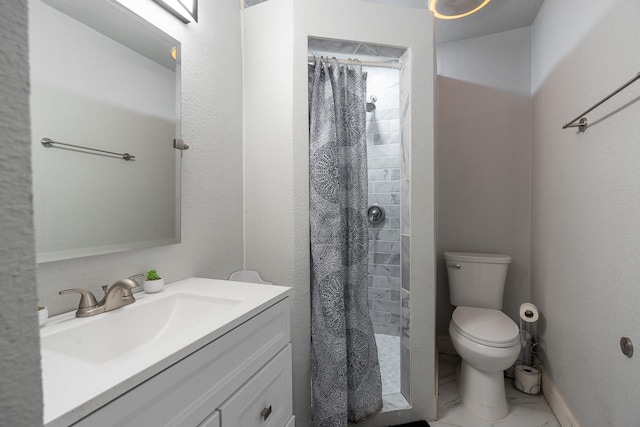 bathroom with curtained shower, vanity, and toilet