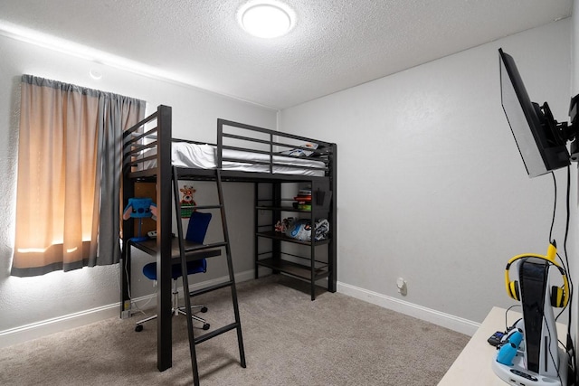 carpeted bedroom with a textured ceiling