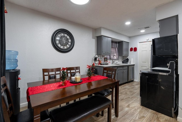 dining area featuring sink