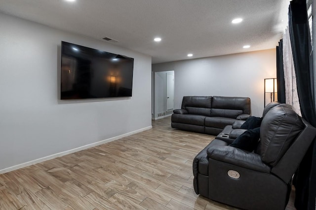 living room with light hardwood / wood-style floors