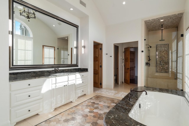 bathroom with shower with separate bathtub, lofted ceiling, and vanity