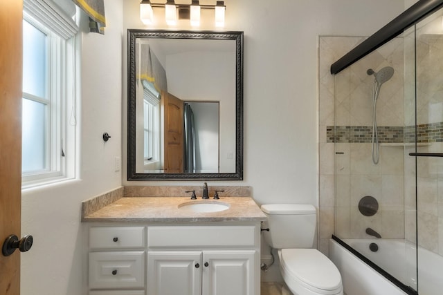 full bathroom featuring vanity, toilet, and enclosed tub / shower combo