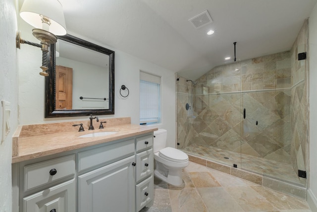 bathroom with toilet, an enclosed shower, and vanity