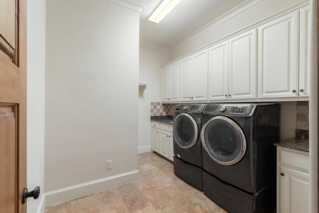 clothes washing area featuring cabinets, separate washer and dryer, and ornamental molding