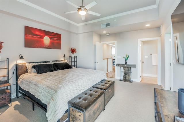 bedroom featuring connected bathroom, light colored carpet, ceiling fan, and crown molding