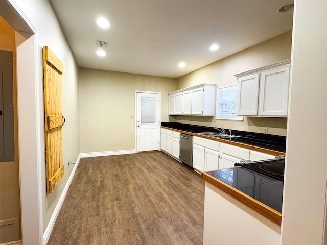 kitchen with sink, stainless steel dishwasher, tile countertops, hardwood / wood-style floors, and white cabinets