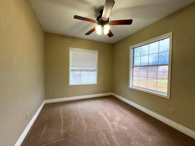 carpeted empty room with ceiling fan