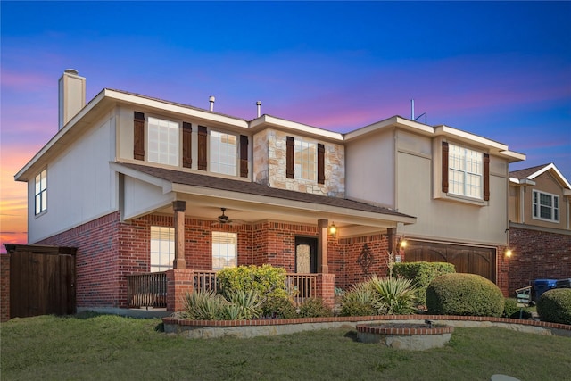 view of front of house with a porch, a garage, and ceiling fan