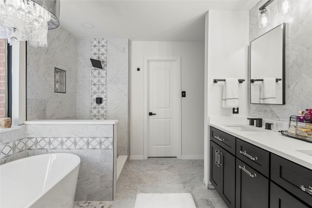 bathroom featuring vanity, independent shower and bath, and tile walls