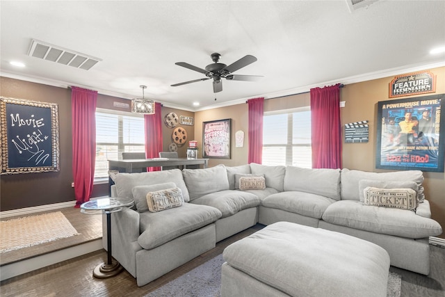 living room featuring crown molding, ceiling fan, and wood-type flooring