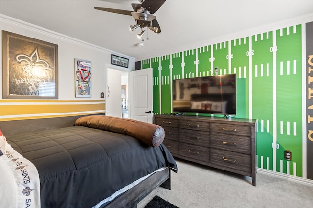 carpeted bedroom with crown molding and ceiling fan