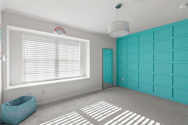 interior space featuring crown molding and light colored carpet