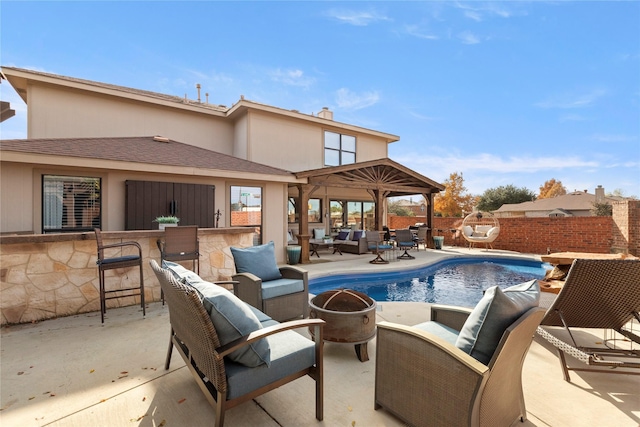 view of pool featuring an outdoor hangout area, an outdoor bar, and a patio area