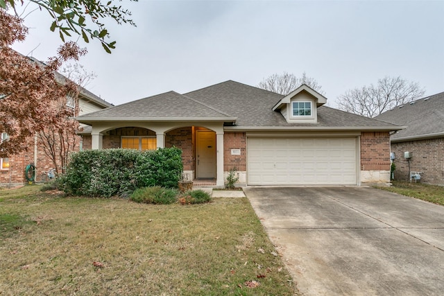 view of front of home with a garage and a front yard