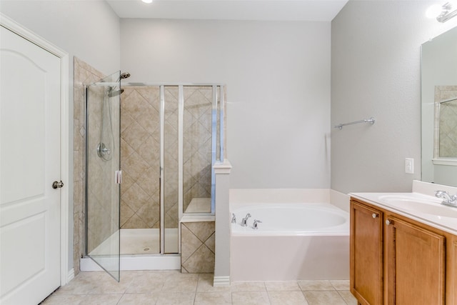 bathroom with vanity, independent shower and bath, and tile patterned flooring