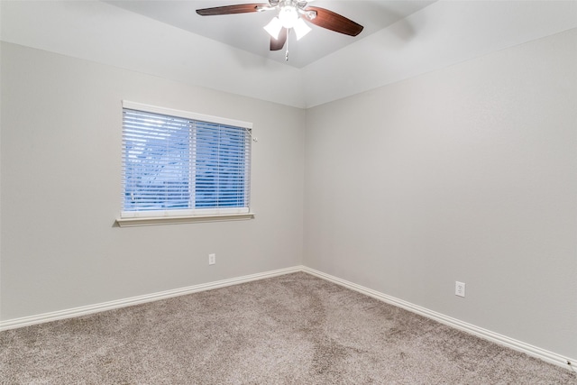 carpeted empty room featuring ceiling fan and lofted ceiling